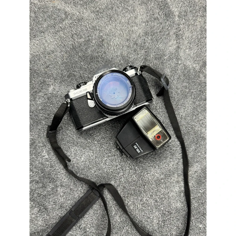 Pentax ME Super 35mm SLR Camera w 50mm Lens AF200T‎ Flash Vintage Kit